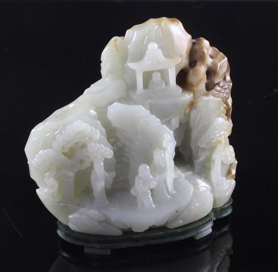 A Chinese pale celadon and russet jade boulder carving, height 10cm